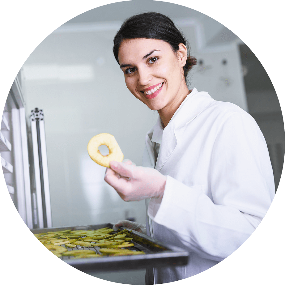 Food technologist inspecting a dried apple slice